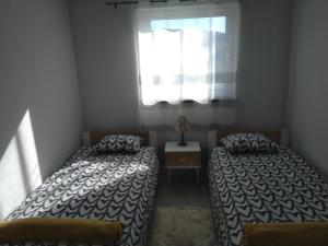 Ένα ή περισσότερα κρεβάτια σε δωμάτιο στο DOMeK NINA