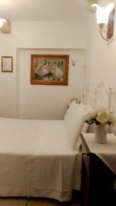 A bed or beds in a room at B&B DIMORA PALMIERI