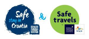 two stickers with the words safe travels and stay in croatia at Apartments Basek in Supetarska Draga