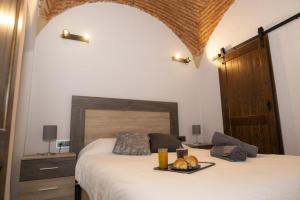 Posteľ alebo postele v izbe v ubytovaní Elegante Apartamento para 5 en el centro de Cáceres con wifi