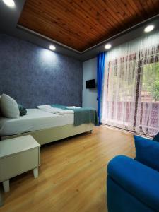 Giường trong phòng chung tại Kuloğlu Otel ve Restoran