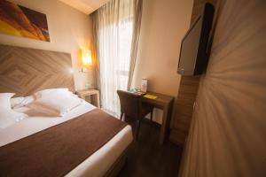 Postel nebo postele na pokoji v ubytování Hotel Aroi Ponferrada