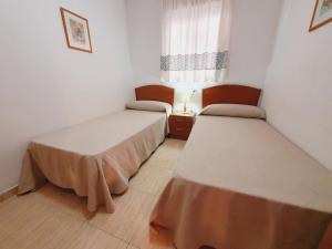 Posteľ alebo postele v izbe v ubytovaní Apartamento Acapulco Holiday + 8 fotografií