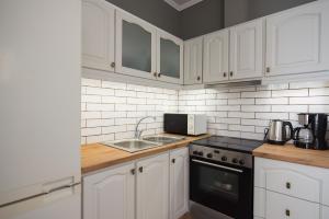 Kuchyň nebo kuchyňský kout v ubytování Liovore Apartments
