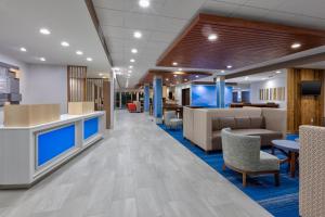 a lobby of a hospital with chairs and tables at Holiday Inn Express & Suites Wooster by IHG in Wooster
