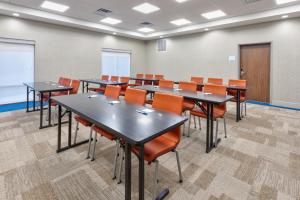 a classroom with tables and chairs in a room at Holiday Inn Express & Suites - Wooster, an IHG Hotel in Wooster