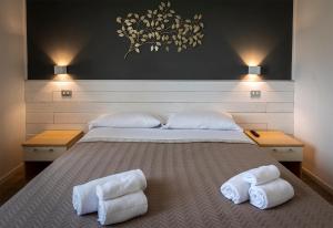 A bed or beds in a room at New Inn Residence