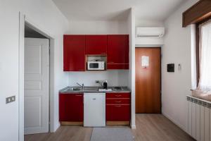 A kitchen or kitchenette at New Inn Residence