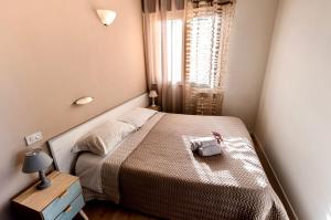 A bed or beds in a room at New Inn Residence