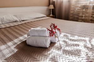 A bed or beds in a room at New Inn Residence