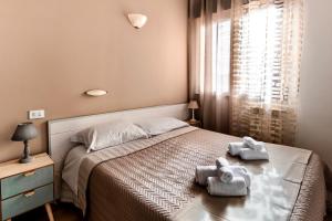 A bed or beds in a room at New Inn Residence