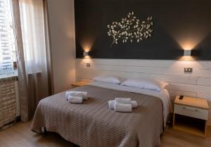 A bed or beds in a room at New Inn Residence