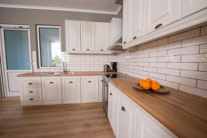 Kuchyň nebo kuchyňský kout v ubytování Liovore Apartments