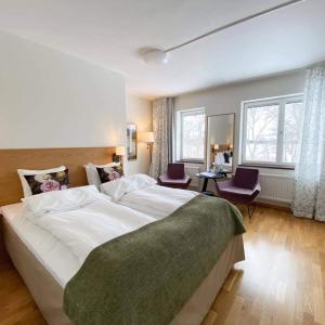 Postel nebo postele na pokoji v ubytování Wiks Slott