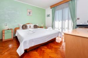 Ein Bett oder Betten in einem Zimmer der Unterkunft Villa Allegria