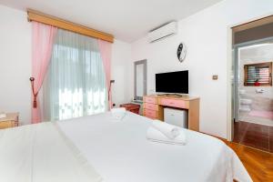 Ein Bett oder Betten in einem Zimmer der Unterkunft Villa Allegria