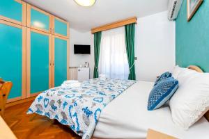 Ein Bett oder Betten in einem Zimmer der Unterkunft Villa Allegria