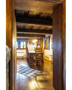 a dining room with a table and chairs at Modrá chalúpka in Kremnica