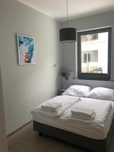 Posteľ alebo postele v izbe v ubytovaní Baltic Blue Apartamenty Pobierowo