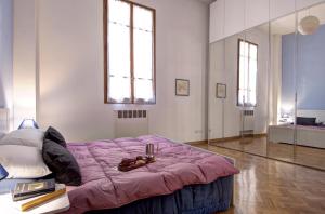Posteľ alebo postele v izbe v ubytovaní GetTheKey Battisti Apartment