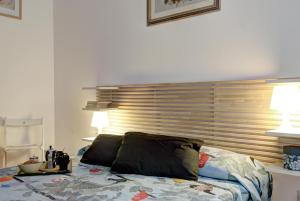 Posteľ alebo postele v izbe v ubytovaní GetTheKey Battisti Apartment