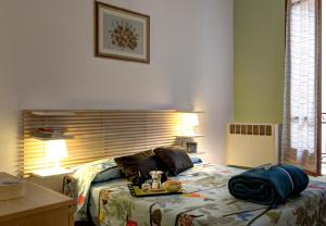 Posteľ alebo postele v izbe v ubytovaní GetTheKey Battisti Apartment