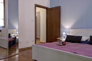 Posteľ alebo postele v izbe v ubytovaní GetTheKey Battisti Apartment