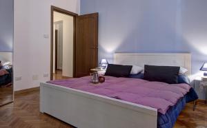 Posteľ alebo postele v izbe v ubytovaní GetTheKey Battisti Apartment