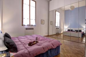 Säng eller sängar i ett rum på GetTheKey Battisti Apartment