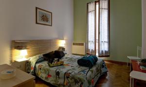 Posteľ alebo postele v izbe v ubytovaní GetTheKey Battisti Apartment
