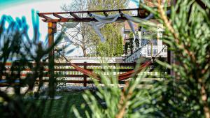 a playground with a hammock in a yard at Dunavska Kuća in Smederevo