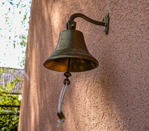 a bell on the side of a wall at Dunavska Kuća in Smederevo
