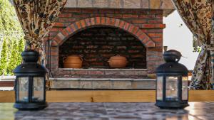 a brick oven with two lights on a table at Dunavska Kuća in Smederevo