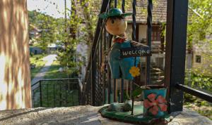 a statue of a woman with a well one sign at Dunavska Kuća in Smederevo