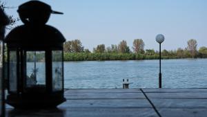 a lantern sitting next to a body of water at Dunavska Kuća in Smederevo