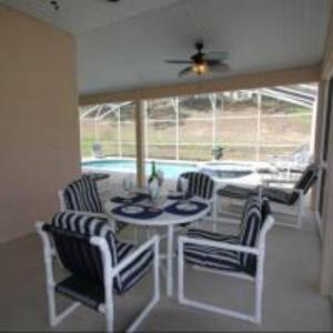 a dining room with a table and four chairs at Mike & Christine's West Haven Vacation Home in Davenport