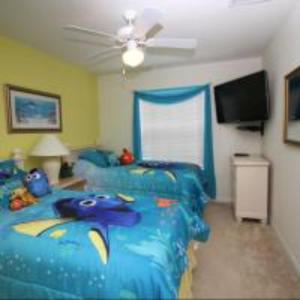 a bedroom with a blue bed with a fish on it at Mike & Christine's West Haven Vacation Home in Davenport +16 photos