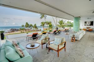 a living room with a view of the ocean at Sielen Diva in Unawatuna