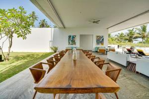 a large conference room with a long wooden table and chairs at Sielen Diva in Unawatuna