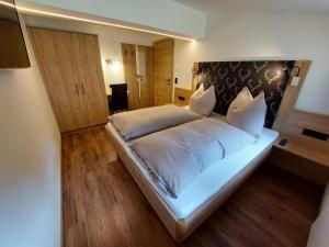 Posteľ alebo postele v izbe v ubytovaní Oberauhof Chalet