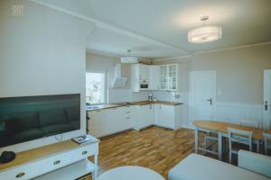 Kuchyňa alebo kuchynka v ubytovaní Hampton Beach, Seaview + 9 fotografií