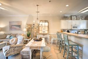 a kitchen and living room with a table and chairs at Little River Condo with Pool Less Than 6 Mi to Beach! in Little River