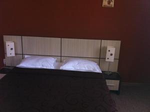 Postel nebo postele na pokoji v ubytování Vilele Soarelui