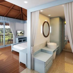y baño con lavabo y espejo. en Symphony Samudra Beachside Jungle Resort And Spa en Port Blair
