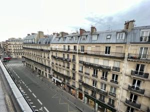 a large building with a lot of windows at Hotel de Saint-Germain in Paris
