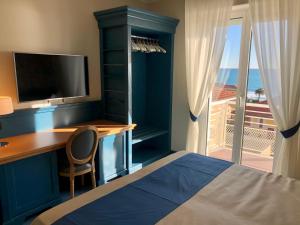 Postel nebo postele na pokoji v ubytování MH HOTEL VARAZZE