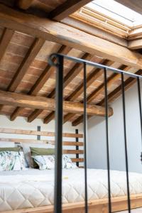 A bed or beds in a room at Acqua di Civita Beauty & Rooms in Mercatello