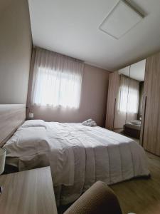 A bed or beds in a room at La Casa di Fiore