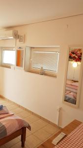 Postel nebo postele na pokoji v ubytování Apartman i sobe Martina