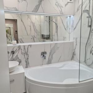 a bathroom with a shower and a toilet and a sink at PremierAtlant in Dnipro +14 photos